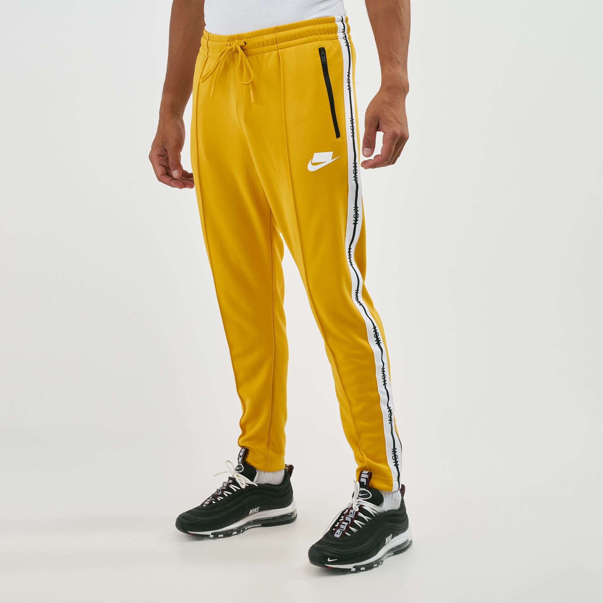 nike track pants yellow