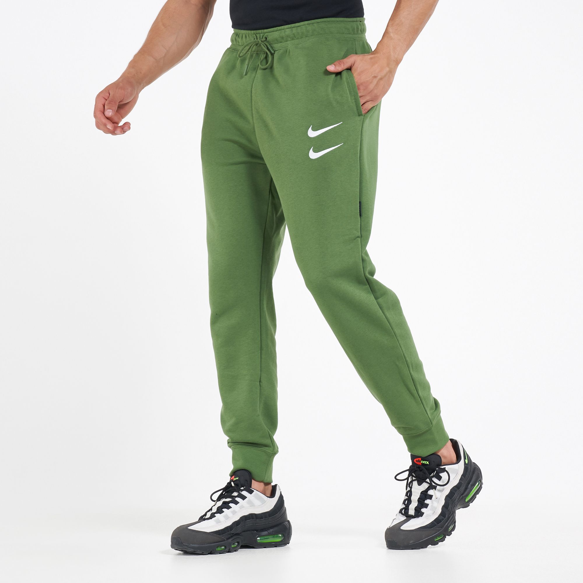 nike swoosh pants green