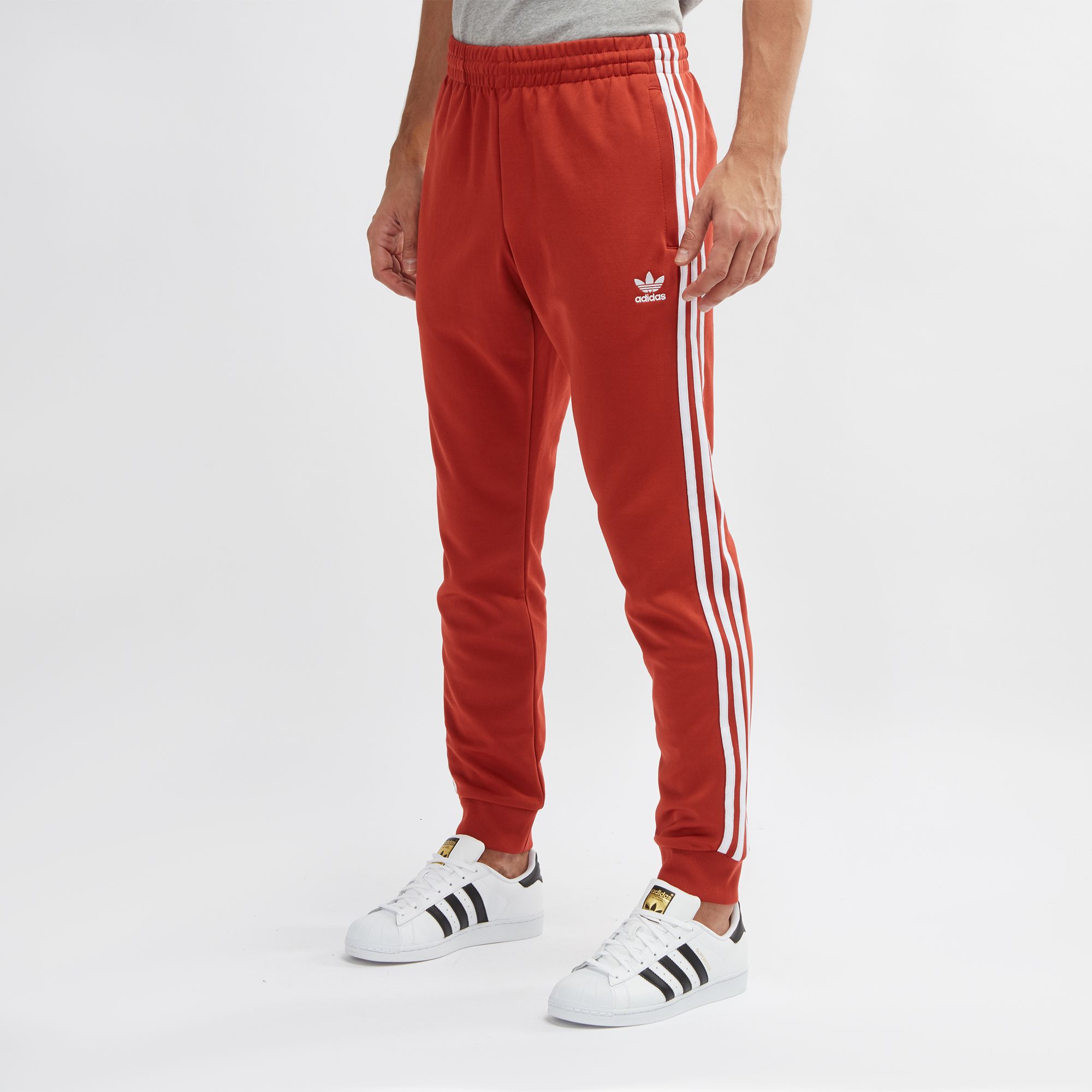 sst track pants orange